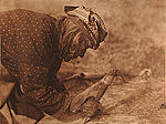 Edward S. Curtis, Plate 643 - Fleshing a Hide - Blackfoot